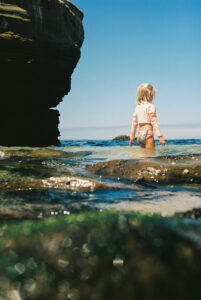 La Jolla beach photo of little girl in the water on Ektar 100 film 