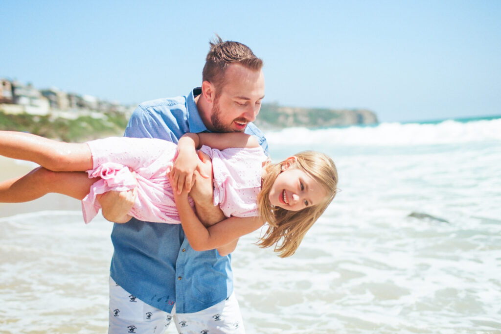 Film photo of father and daughter at Dana Point beach